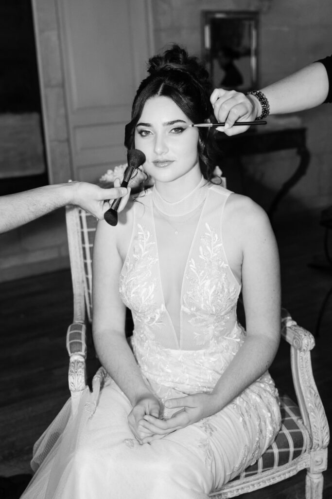 Bride getting her makeup done before a destination wedding ceremony in Provence, south of France