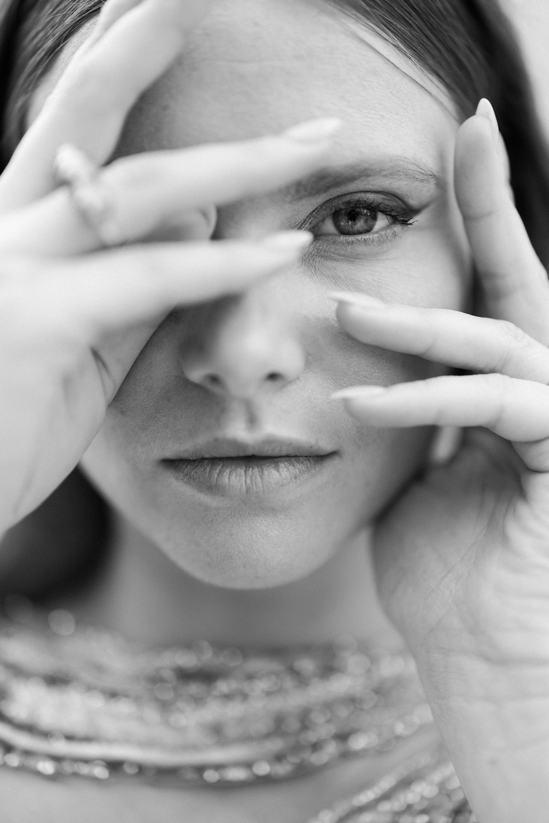 Editorial bride portrait with artistic hand pose in natural light at a destination wedding in Provence, south of France