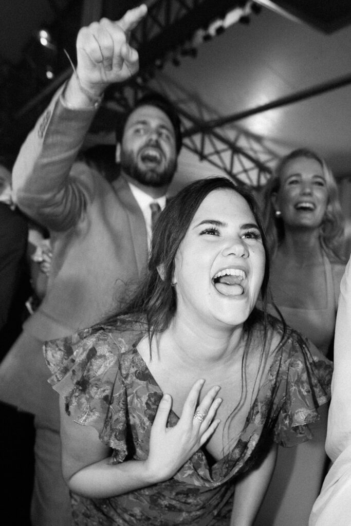 Black and white photo of guests dancing at a wedding reception party in Provence, south of France